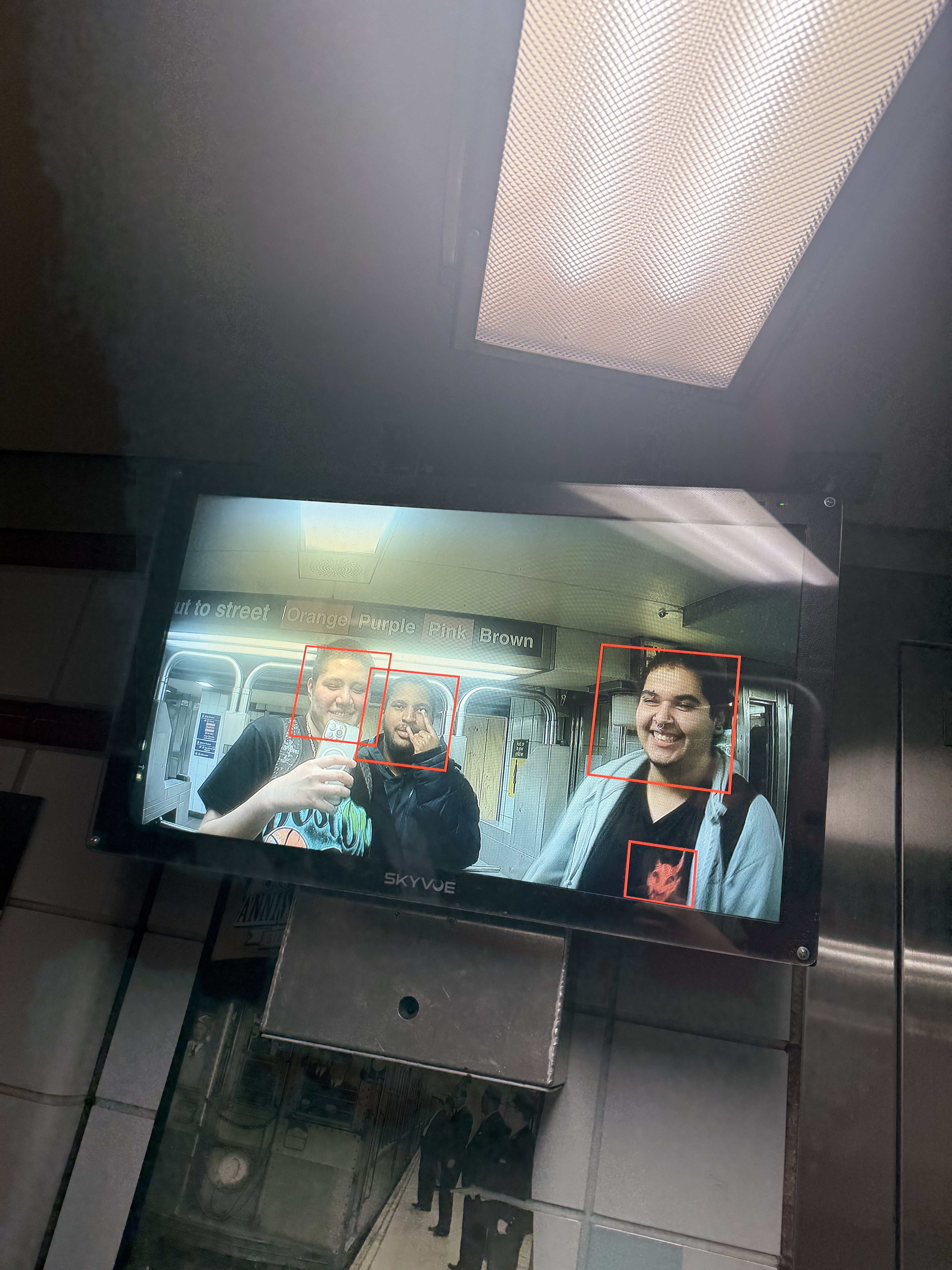 CTA subway security screen showing two people smiling