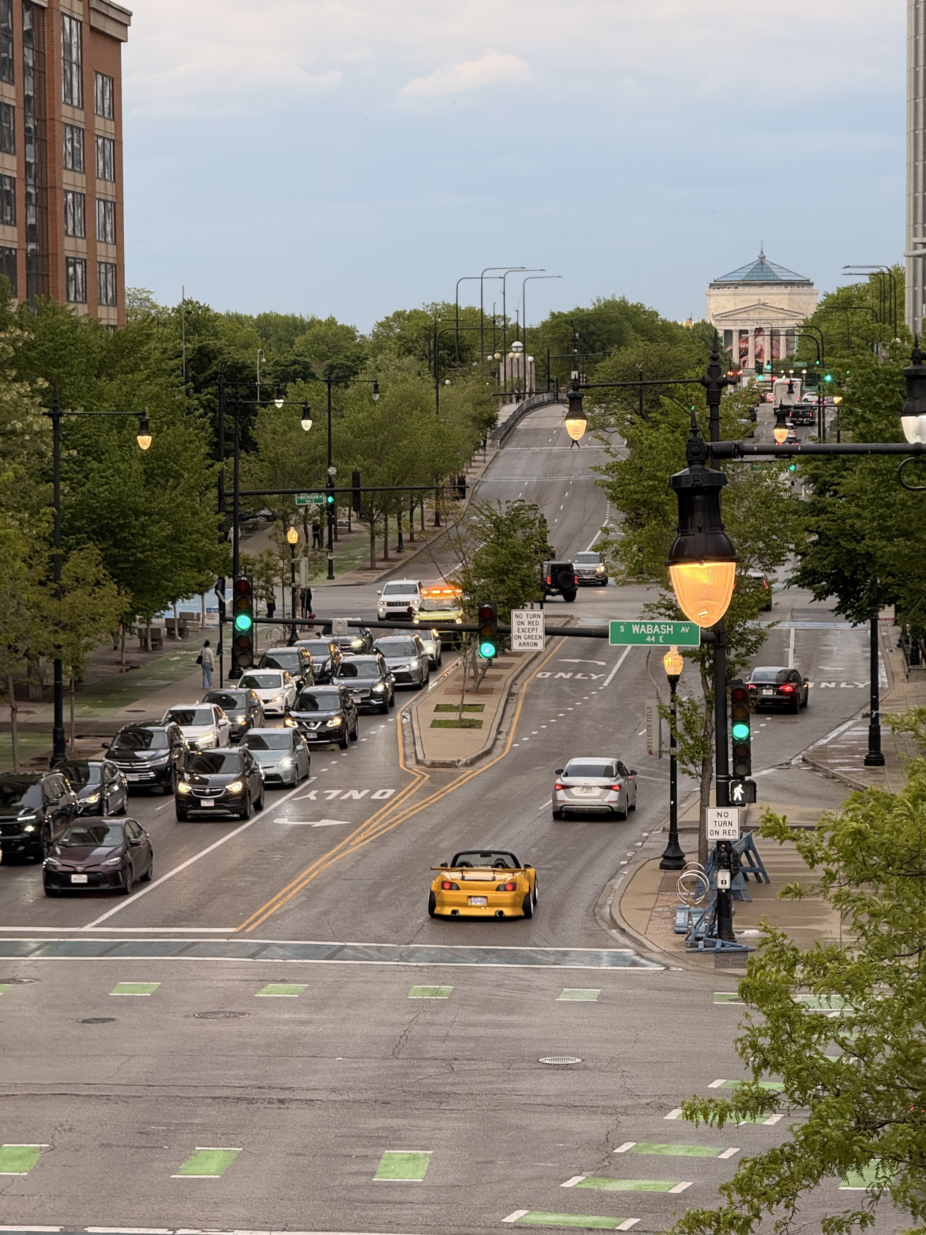 Chicago Michigan Avenue with a yellow convertible in traffic